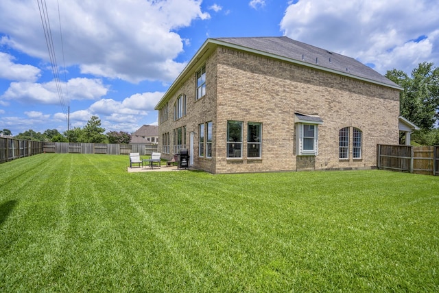 10522 Kirkwell Manor Ct, Spring, TX 77379 - rear view of house featuring brick siding and a patio