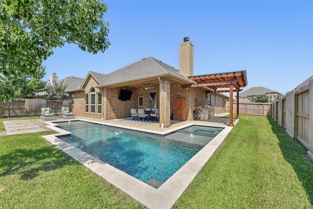 22907 Caverly Ln, Tomball, TX 77375 - back of house featuring a chimney, an outdoor kitchen, brick siding, a patio area, and a ceiling fan