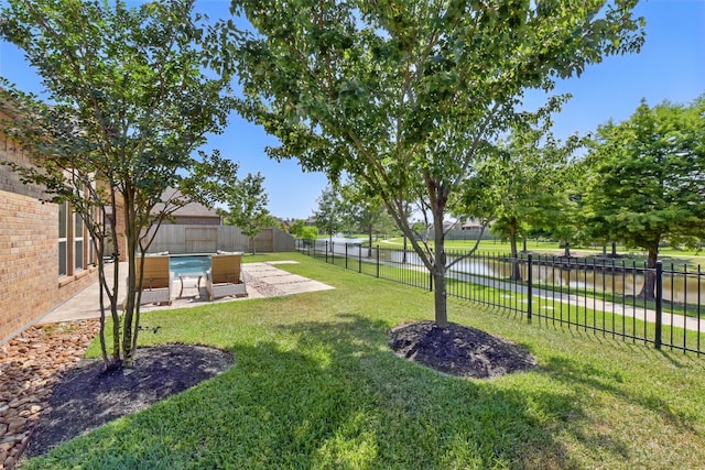 22907 Caverly Ln, Tomball, TX 77375 - view of yard featuring a water view and a patio area
