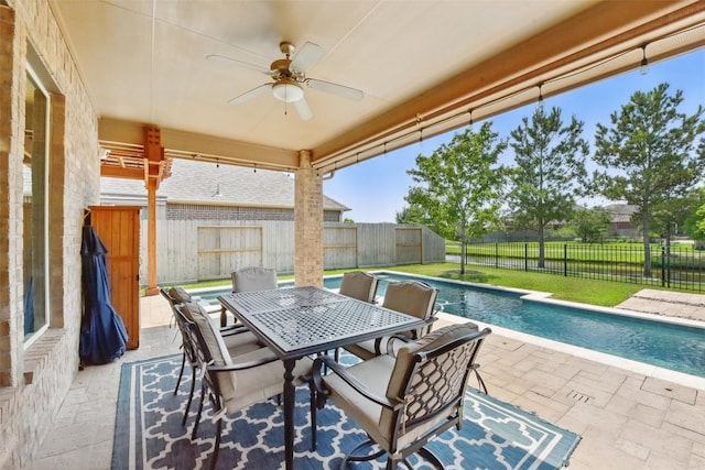 22907 Caverly Ln, Tomball, TX 77375 - fenced backyard with ceiling fan, a patio, and outdoor dining space