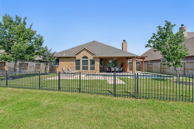 22907 Caverly Ln, Tomball, TX 77375 - back of property with a chimney, brick siding, a patio, and a shingled roof