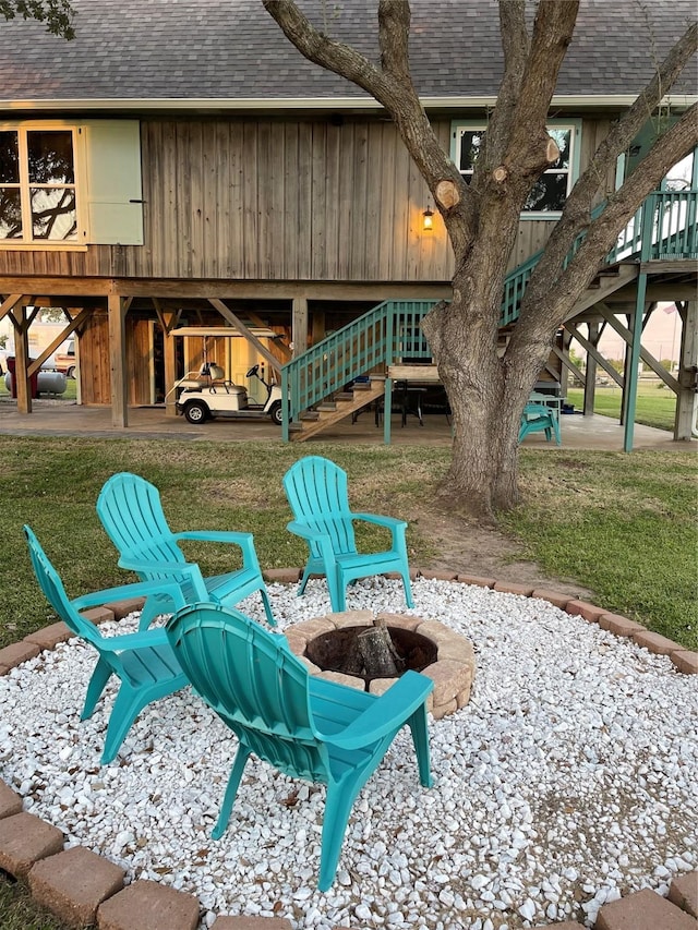 1981 County Road 291, Sargent, TX 77414 - view of patio with a fire pit and stairway