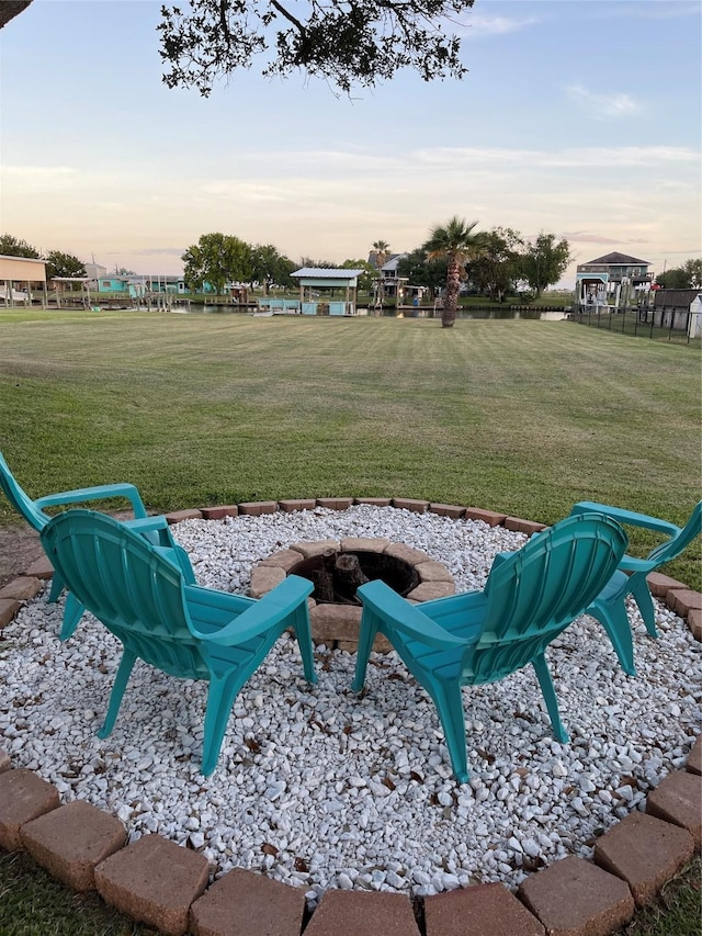 1981 County Road 291, Sargent, TX 77414 - yard at dusk with an outdoor fire pit and a yard