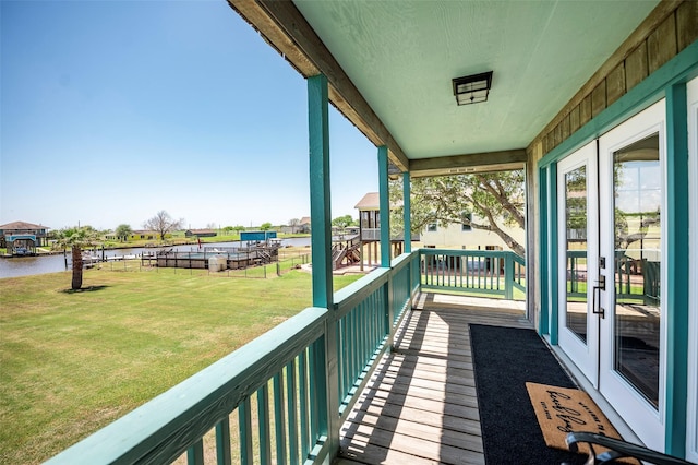 1981 County Road 291, Sargent, TX 77414 - balcony with french doors and a water view