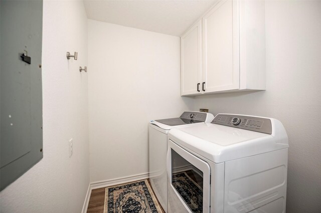 1981 County Road 291, Sargent, TX 77414 - laundry area featuring cabinet space, washer and dryer, wood finished floors, and baseboards