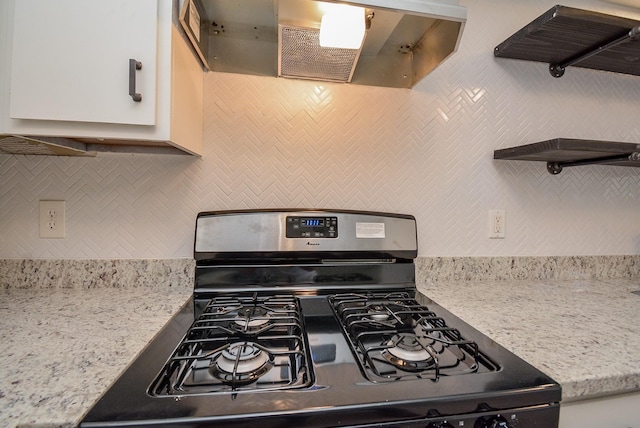 3206 Windchase Blvd Unit 471, Houston, TX 77082 - kitchen featuring black gas range, backsplash, open shelves, and exhaust hood