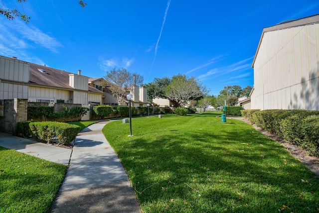 3206 Windchase Blvd Unit 471, Houston, TX 77082 - view of grassy yard featuring a residential view