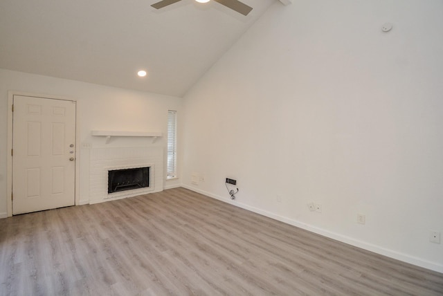 3206 Windchase Blvd Unit 471, Houston, TX 77082 - unfurnished living room with vaulted ceiling, a ceiling fan, baseboards, wood finished floors, and recessed lighting
