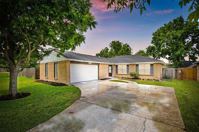 16631 Quiet Quail Dr, Missouri City, TX 77489 - single story home with a garage, brick siding, and driveway