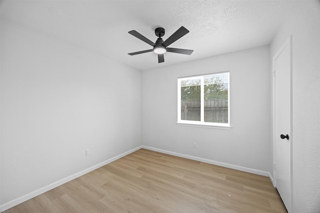 16631 Quiet Quail Dr, Missouri City, TX 77489 - empty room featuring light wood-style flooring, baseboards, ceiling fan, and a textured ceiling