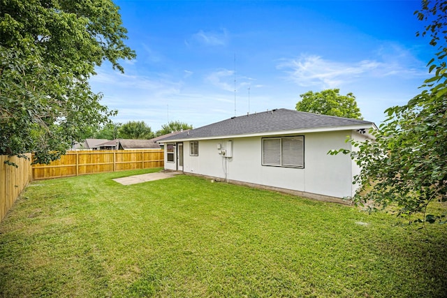 16631 Quiet Quail Dr, Missouri City, TX 77489 - back of property with roof with shingles, a patio, and stucco siding