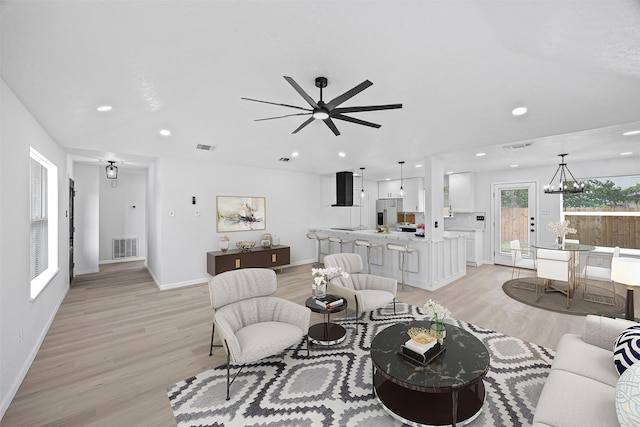 16631 Quiet Quail Dr, Missouri City, TX 77489 - living room with light wood-style flooring, baseboards, recessed lighting, and a ceiling fan