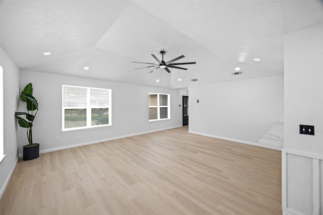 16631 Quiet Quail Dr, Missouri City, TX 77489 - unfurnished living room with recessed lighting, a ceiling fan, light wood-type flooring, vaulted ceiling, and baseboards