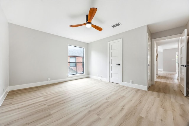 2829 Timmons Ln Unit 174, Houston, TX 77027 - unfurnished bedroom with light wood-type flooring, baseboards, and ceiling fan