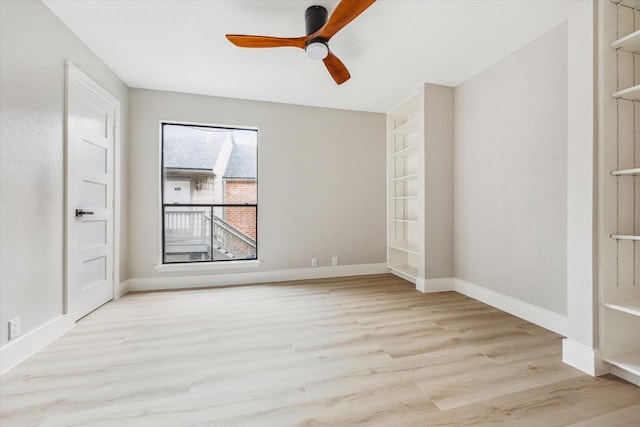 2829 Timmons Ln Unit 174, Houston, TX 77027 - empty room featuring wood finished floors, a ceiling fan, and baseboards