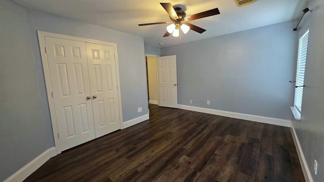 6623 Emerald Ash Ct, Humble, TX 77346 - unfurnished bedroom featuring dark wood-style floors, baseboards, a closet, and ceiling fan