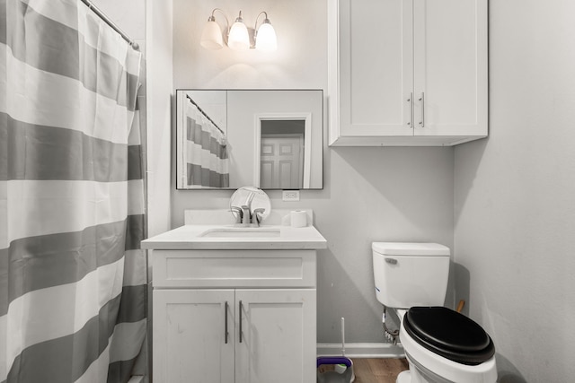 8534 Woodlyn Rd, Houston, TX 77028 - full bathroom with vanity, wood finished floors, and curtained shower