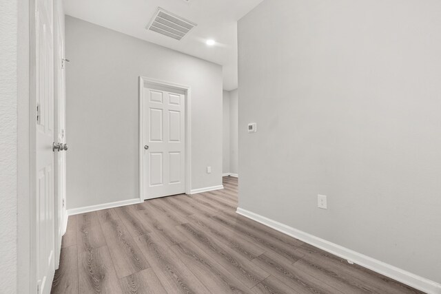 8534 Woodlyn Rd, Houston, TX 77028 - spare room featuring wood finished floors and recessed lighting