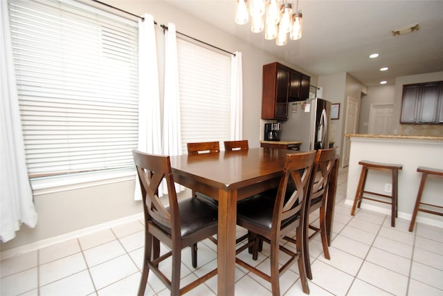 9723 Therrell Dr, Houston, TX 77064 - dining space featuring light tile patterned floors, a chandelier, baseboards, and recessed lighting