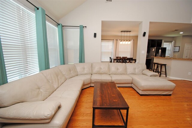 9723 Therrell Dr, Houston, TX 77064 - living room featuring wood finished floors and lofted ceiling