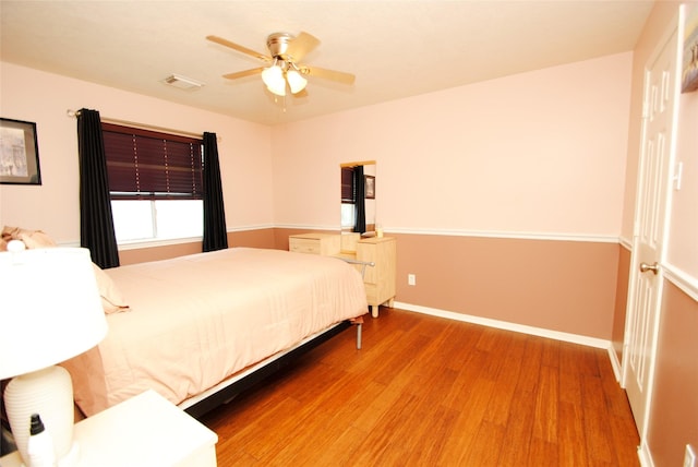 9723 Therrell Dr, Houston, TX 77064 - bedroom featuring wood finished floors, baseboards, and ceiling fan