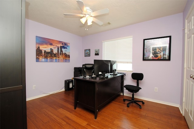 9723 Therrell Dr, Houston, TX 77064 - home office with ceiling fan, wood finished floors, and baseboards