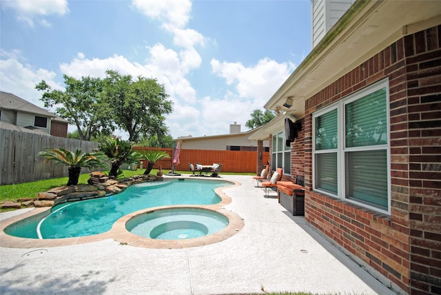 9723 Therrell Dr, Houston, TX 77064 - view of swimming pool with a patio area, a fenced backyard, and a pool with connected hot tub