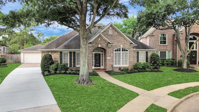 22127 Glen Arden Ln, Katy, TX 77450 - traditional-style home featuring brick siding and roof with shingles