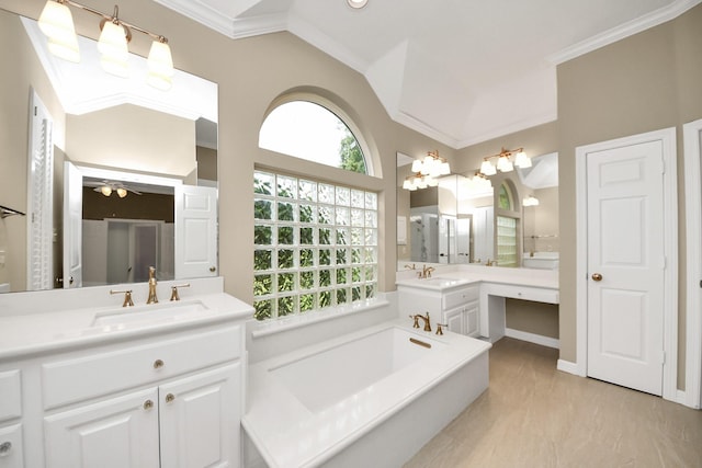 22127 Glen Arden Ln, Katy, TX 77450 - bathroom featuring ornamental molding, a bath, a ceiling fan, and two vanities
