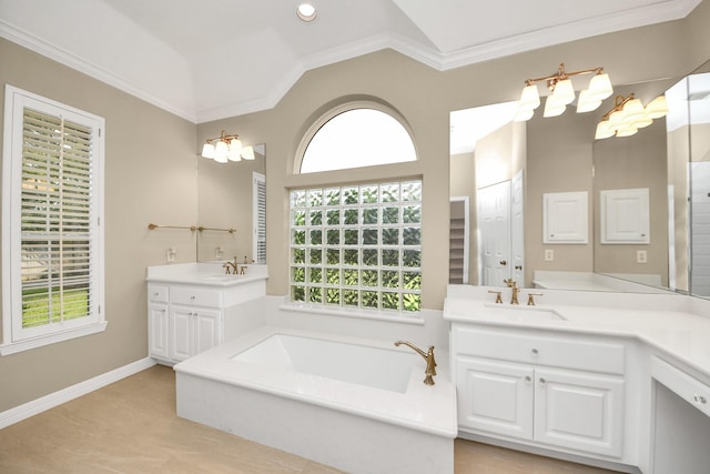 22127 Glen Arden Ln, Katy, TX 77450 - full bathroom with ornamental molding, two vanities, a bath, vaulted ceiling, and baseboards
