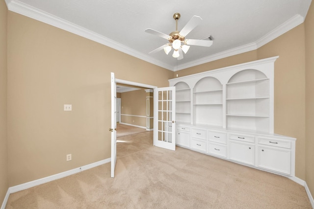 22127 Glen Arden Ln, Katy, TX 77450 - spare room with light carpet, french doors, crown molding, baseboards, and ceiling fan
