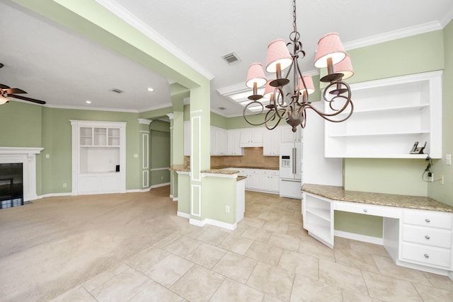 22127 Glen Arden Ln, Katy, TX 77450 - kitchen with open shelves, high end white refrigerator, crown molding, a ceiling fan, and a chandelier