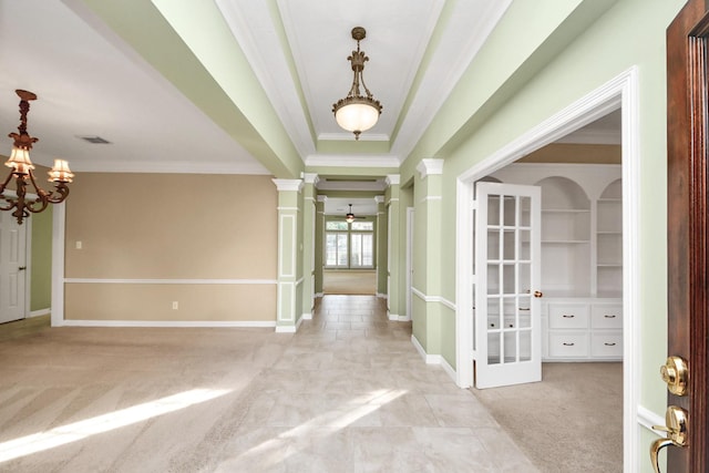 22127 Glen Arden Ln, Katy, TX 77450 - entrance foyer with ornamental molding, ornate columns, a chandelier, light carpet, and baseboards