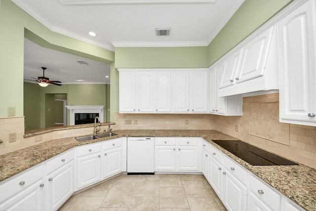 22127 Glen Arden Ln, Katy, TX 77450 - kitchen with a sink, black electric stovetop, tasteful backsplash, ceiling fan, and white dishwasher