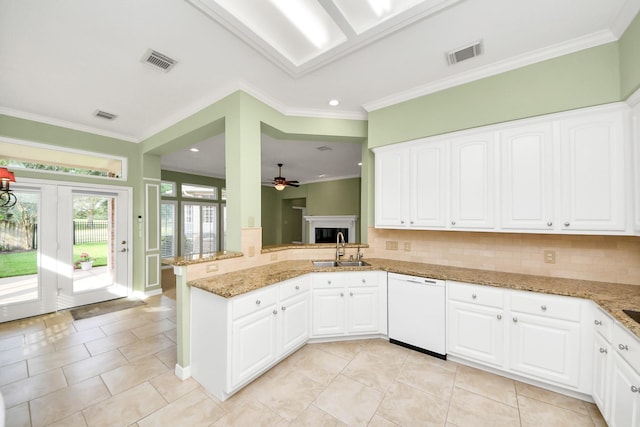22127 Glen Arden Ln, Katy, TX 77450 - kitchen with white dishwasher, a sink, backsplash, ornamental molding, and a ceiling fan