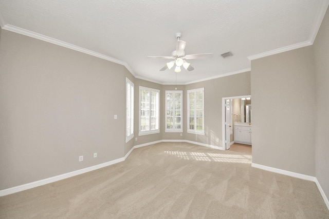 22127 Glen Arden Ln, Katy, TX 77450 - spare room featuring a ceiling fan, baseboards, light colored carpet, and crown molding