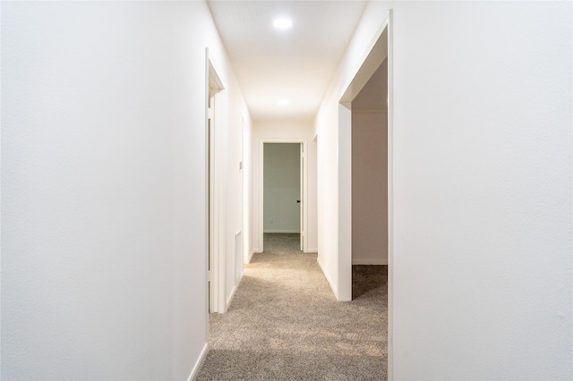 17426 Pinewood Forest Dr, Spring, TX 77379 - corridor featuring light carpet, baseboards, and recessed lighting