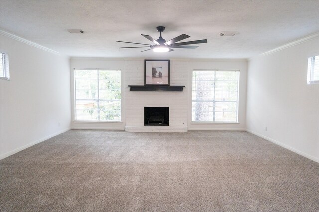 17426 Pinewood Forest Dr, Spring, TX 77379 - unfurnished living room with crown molding, a ceiling fan, carpet floors, and plenty of natural light