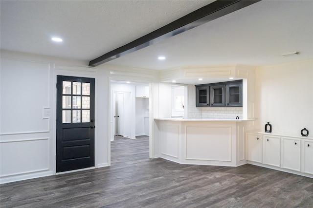 17426 Pinewood Forest Dr, Spring, TX 77379 - kitchen with beam ceiling, dark wood finished floors, glass insert cabinets, recessed lighting, and backsplash