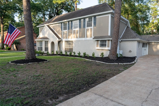 17426 Pinewood Forest Dr, Spring, TX 77379 - view of front of home featuring brick siding, a shingled roof, a garage, a front lawn, and concrete driveway