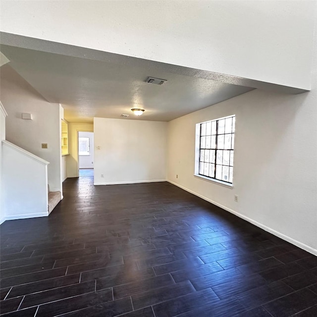 16800 Sugar Pine Dr Unit C21, Houston, TX 77090 - unfurnished room with dark wood-style floors, baseboards, and stairs