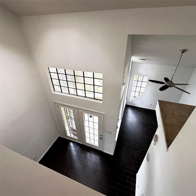 16800 Sugar Pine Dr Unit C21, Houston, TX 77090 - foyer featuring a high ceiling, a ceiling fan, baseboards, and wood finished floors