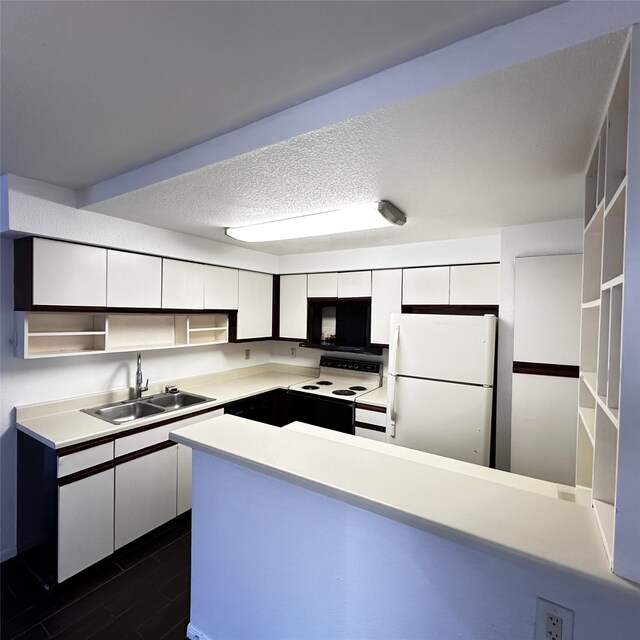 16800 Sugar Pine Dr Unit C21, Houston, TX 77090 - kitchen with freestanding refrigerator, a sink, electric range oven, white cabinetry, and light countertops