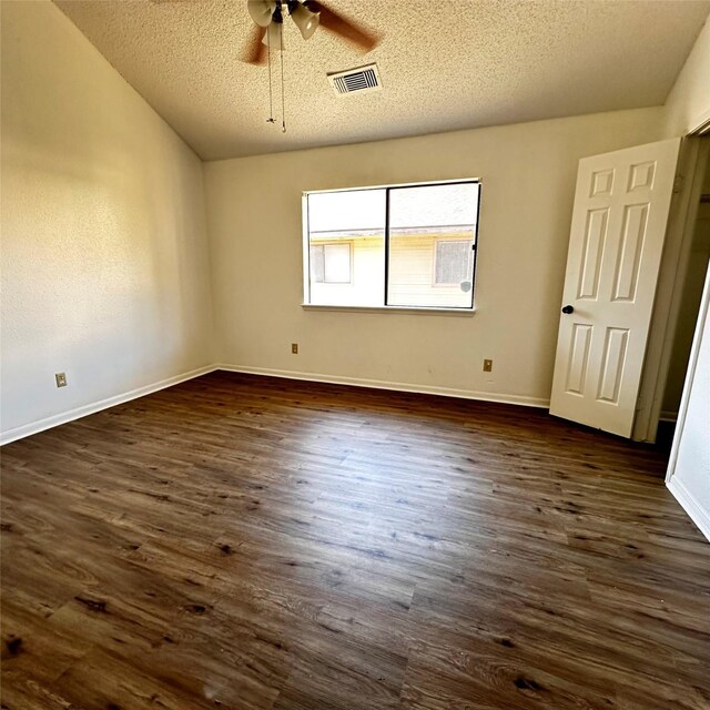 16800 Sugar Pine Dr Unit C21, Houston, TX 77090 - spare room with a ceiling fan, a textured ceiling, dark wood-style floors, and baseboards