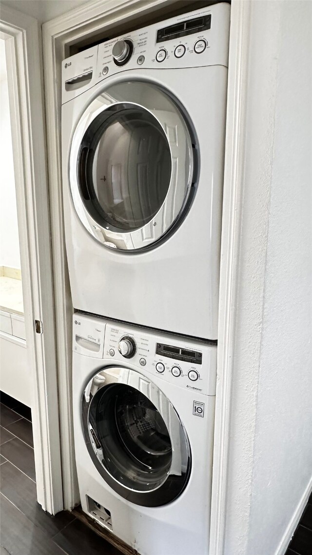16800 Sugar Pine Dr Unit C21, Houston, TX 77090 - laundry room featuring stacked washer / drying machine