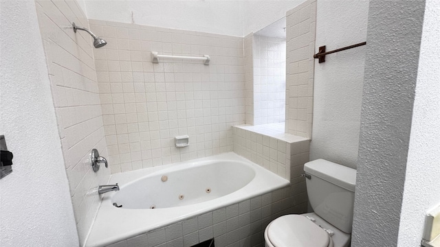 16800 Sugar Pine Dr Unit C21, Houston, TX 77090 - bathroom with a textured wall, toilet, and a combined bath / shower with jetted tub
