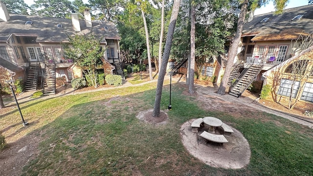 16800 Sugar Pine Dr Unit C21, Houston, TX 77090 - view of green lawn with stairs and a deck
