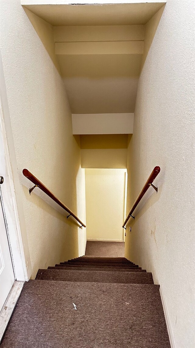 16800 Sugar Pine Dr Unit C21, Houston, TX 77090 - staircase with a textured wall and carpet flooring