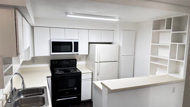 16800 Sugar Pine Dr Unit C21, Houston, TX 77090 - kitchen with white appliances, a sink, light countertops, white cabinets, and a textured ceiling