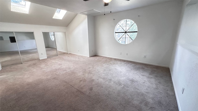 16800 Sugar Pine Dr Unit C21, Houston, TX 77090 - unfurnished bedroom featuring two closets, carpet floors, lofted ceiling, baseboards, and ceiling fan